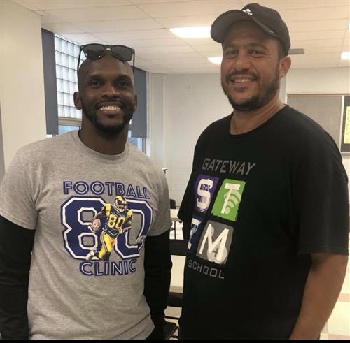 Working with St. Louis Ram's legend Isaac Bruce on his Free Football Camp at Gateway STEM High School 