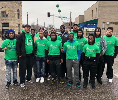 Football Team Volunteers for Water Station at St. Patricks Day Run 